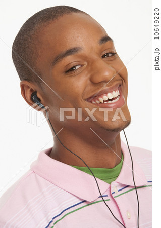 Enjoying the Beat. a Smiling Ethnic Woman Enjoying Her Headphones