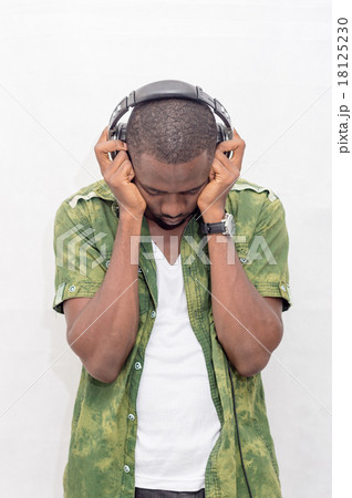 Enjoying the Beat. a Smiling Ethnic Woman Enjoying Her Headphones