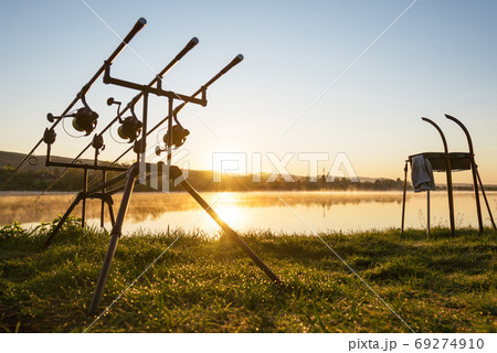 Commercial fishing rods over turquoise water. Fishing equipment on