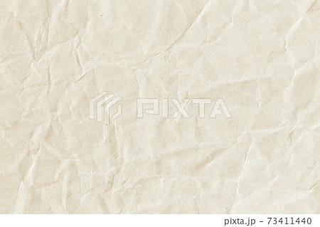 Wrinkled paper texture as background texture. Folded craft paper