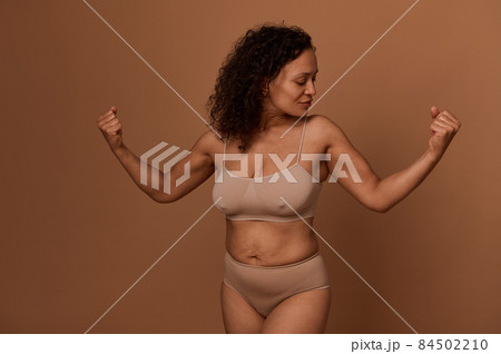 Pretty woman with imperfect body, cellulite and stretch marks