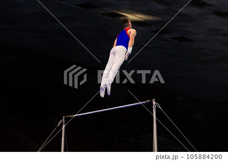 Flexible Professional Female Gymnasts Doing Rhythmic Gymnastics in